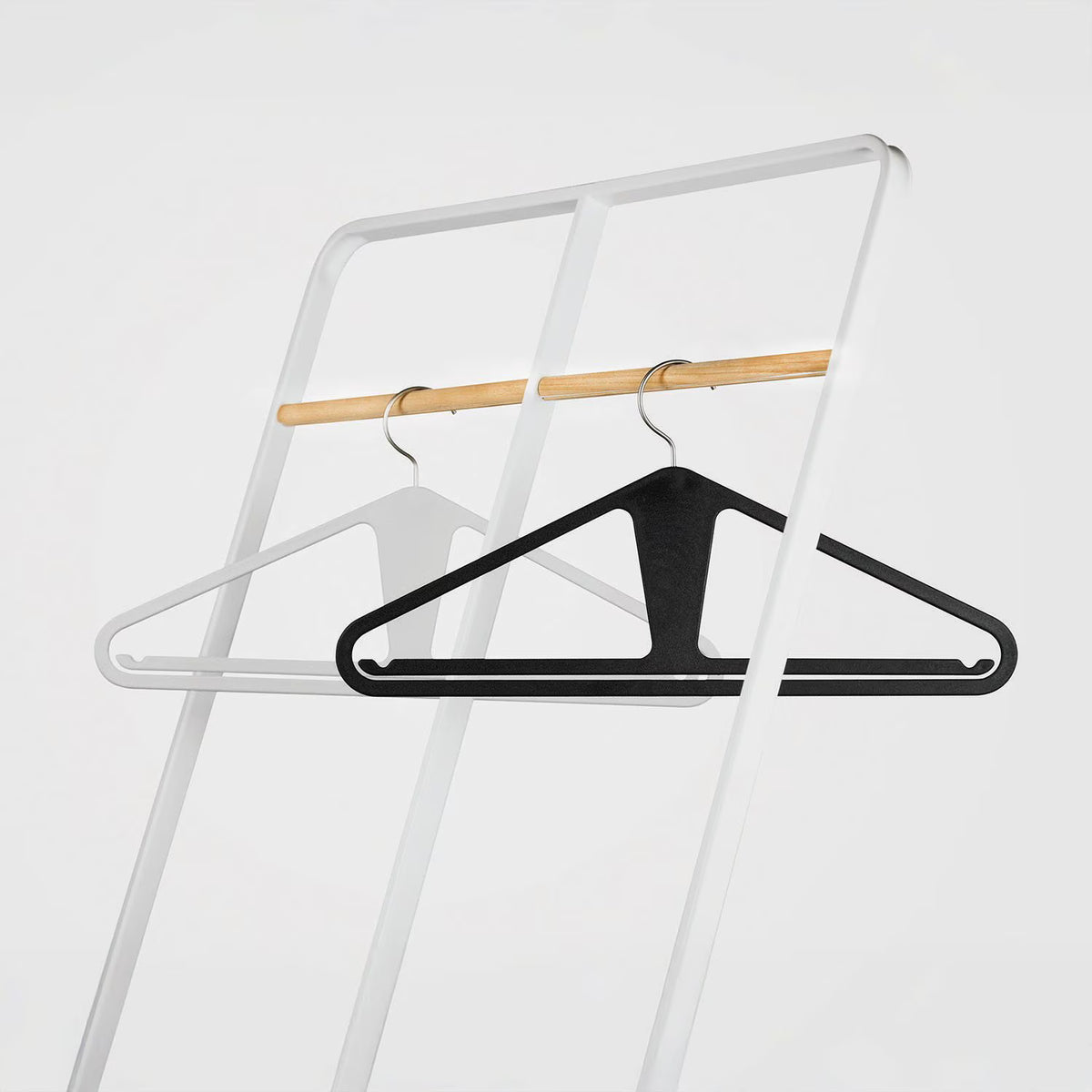 The Slim Kangaroo™ Hanger 40-Pack - Made in Wisconsin, USA with 100% recycled material - The patented design clips in pants, shirts, straps, tanks, jackets and even entire outfits on a single hanger