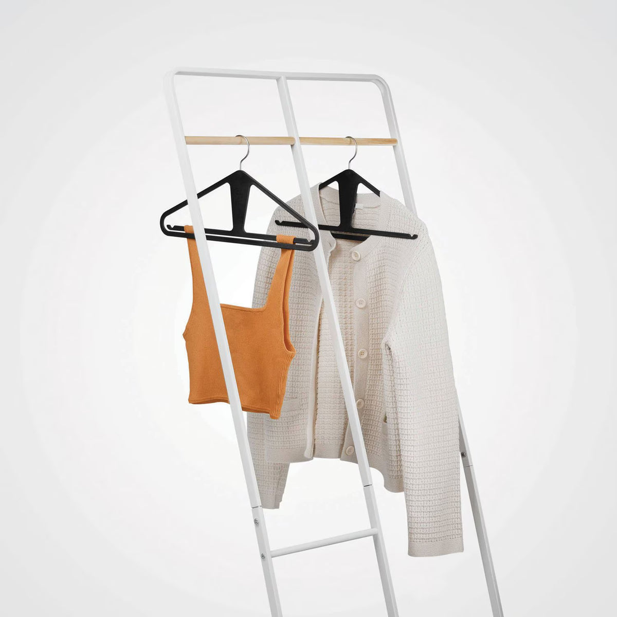 The Slim Kangaroo™ Hanger 40-Pack - Made in Wisconsin, USA with 100% recycled material - The patented design clips in pants, shirts, straps, tanks, jackets and even entire outfits on a single hanger