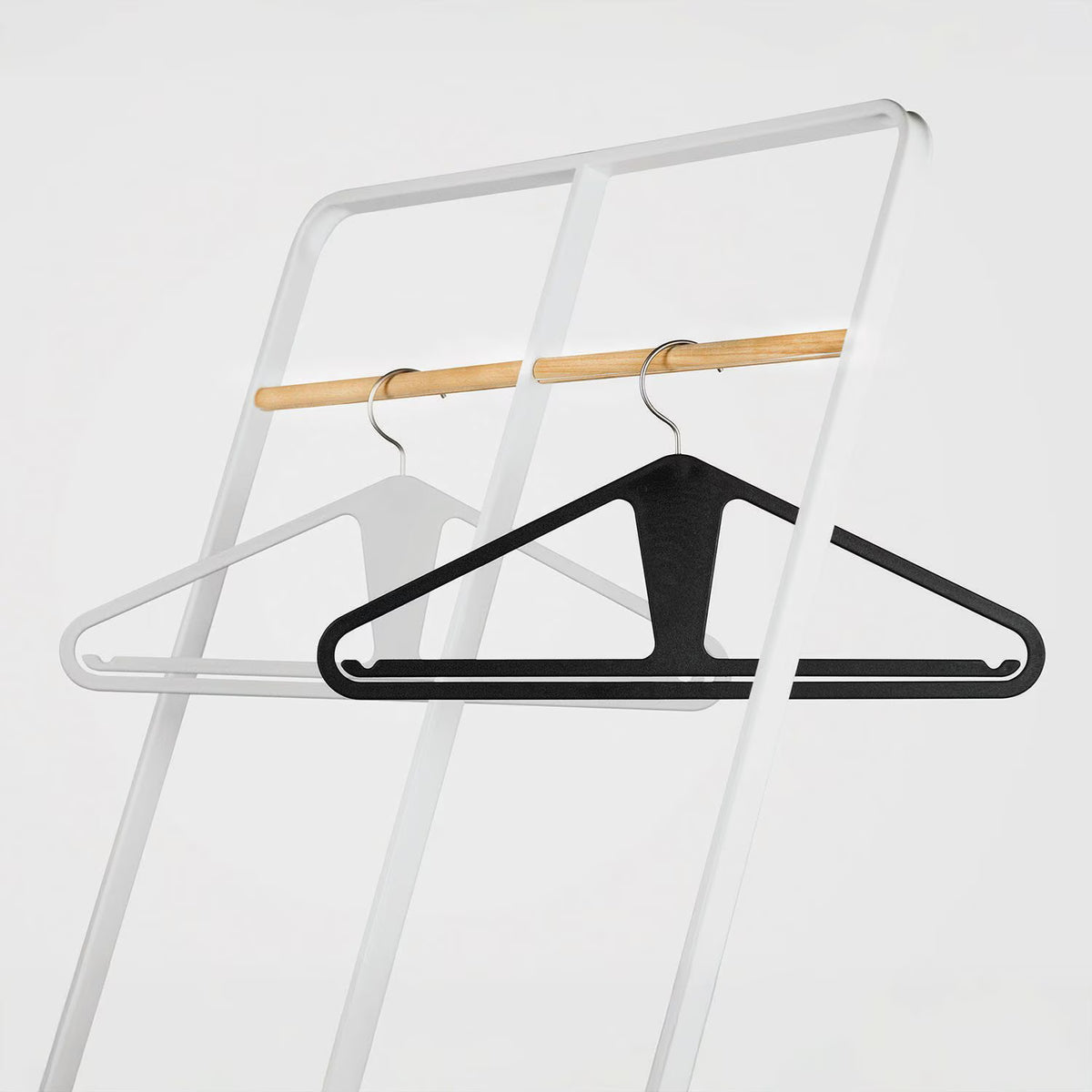 The Slim Kangaroo™ Hanger 40-Pack - Made in Wisconsin, USA with 100% recycled material - The patented design clips in pants, shirts, straps, tanks, jackets and even entire outfits on a single hanger